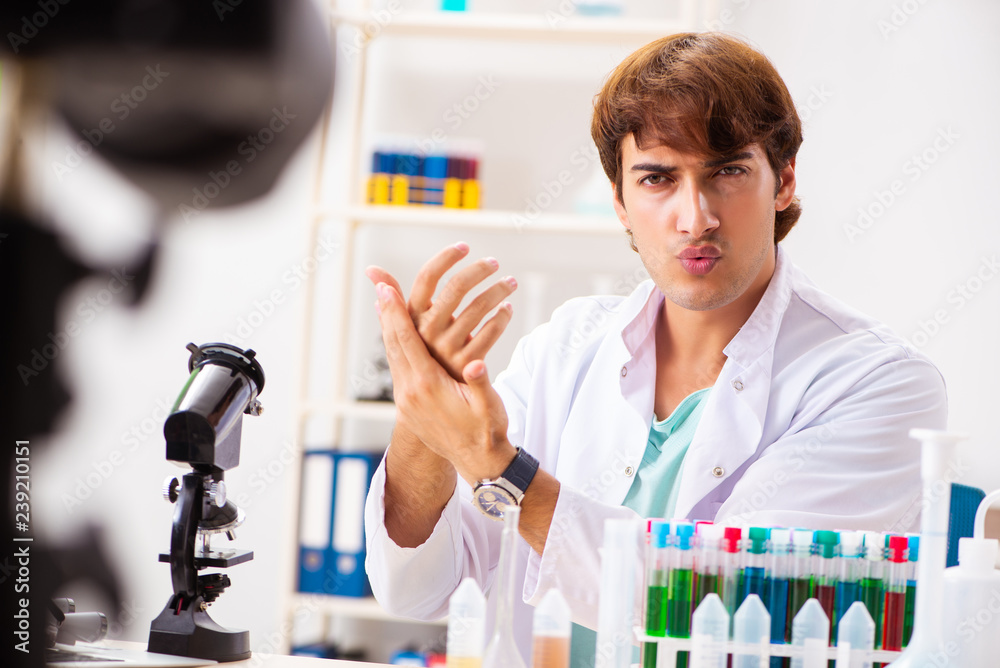 Chemist blogger recording video for his blog Chemist blogger recording video for his blog
