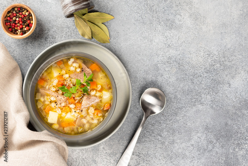 Obraz na płótnie Rassolnik - Traditional Russian soup with pickled cucmbers, pearl barley, meat, pickles, carrots and potatoes on light background. Top view w salonie