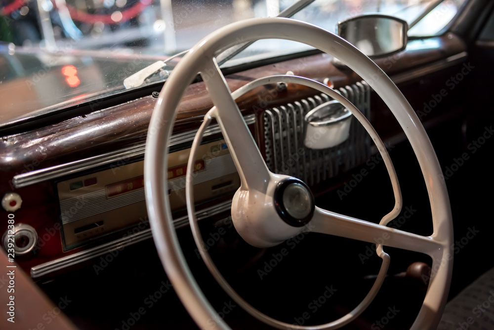 Dashboard with steering wheel of a classic car from the 1970's Dashboard with steering wheel of a classic car from the 1970's