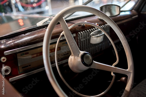 Dashboard with steering wheel of a classic car from the 1970's