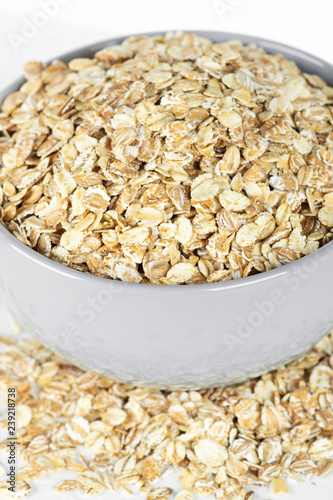 Oat flakes in bowl closeup