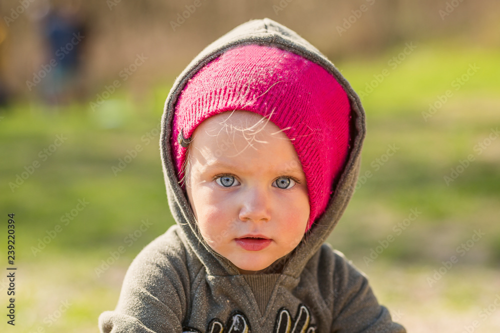 Little girl in an urban setting smiles at the camera Little girl in an urban setting smiles at the camera