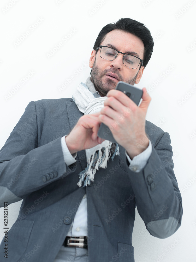 close up. a business man uses his smartphone close up. a business man uses his smartphone