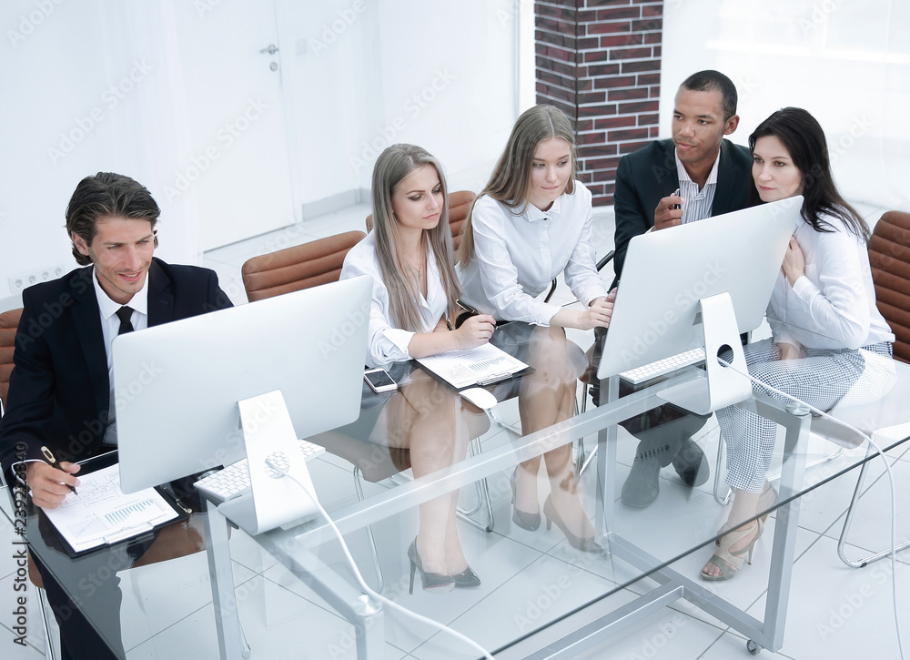 successful managers discussing new business project in modern office successful managers discussing new business project in modern office