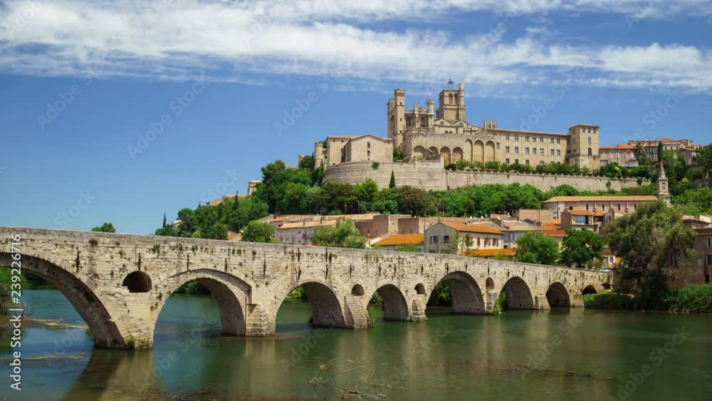 Amazing time-lapse video of old bridge and Saint Nazaire cathedral on the Orb river in Beziers, France. Zooming in motion. Amazing time-lapse video of old bridge and Saint Nazaire cathedral on the Orb river in Beziers, France. Zooming in motion.
