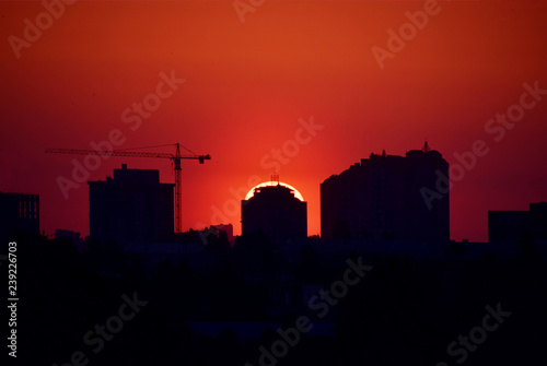 Red dramatic sunset over the city.