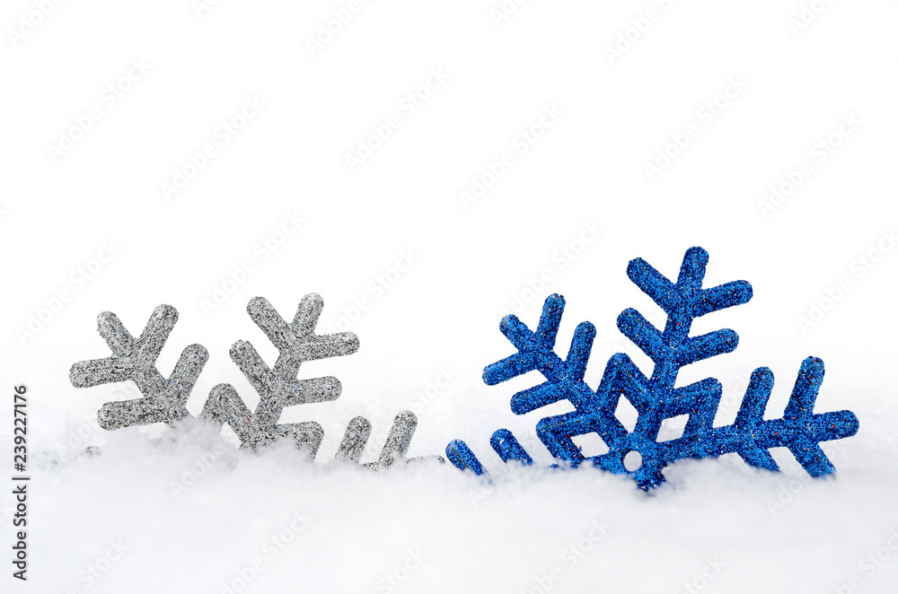 Christmas snowflake in a fluffy, white snowdrift. New Year's holiday toys. Christmas snowflake in a fluffy, white snowdrift. New Year's holiday toys.