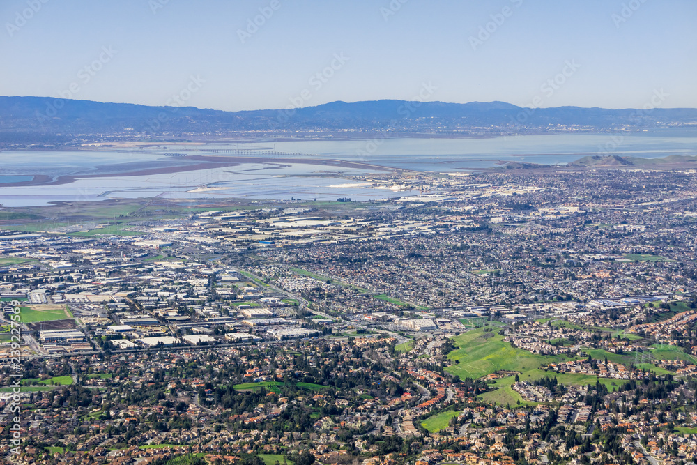 Aerial view of Fremont and Newark on the shoreline of east San Francisco bay area; Dumbarton bridge in the background; Silicon Valley, California Aerial view of Fremont and Newark on the shoreline of east San Francisco bay area; Dumbarton bridge in the background; Silicon Valley, California