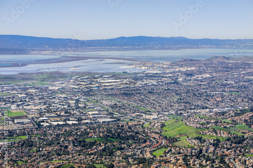 Aerial view of Fremont and Newark on the shoreline of east San Francisco bay area  Dumbarton bridge in the background  Silicon Valley, California © Sundry Photography
