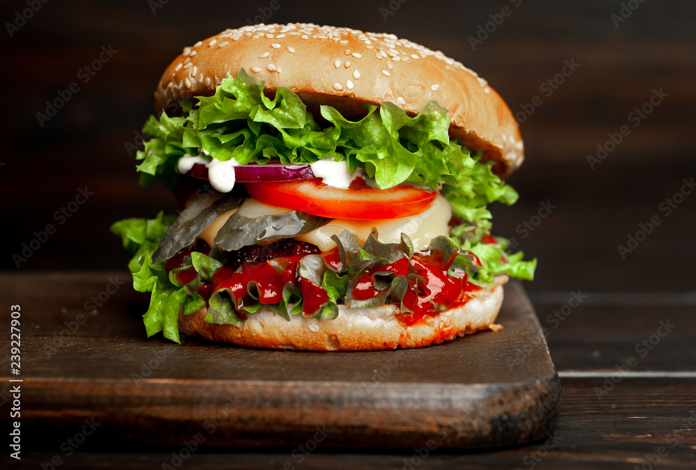 mouth-watering delicious homemade burger used to chop beef on the wooden table