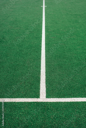 White lines on green soccer or football field. Perpendicular lining. © a_khachatryan
