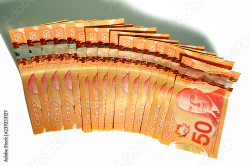 Canadian money spread on a white background. photo