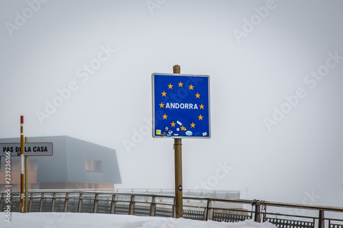 A welcome sign in Andorra in a cold haze weather in Europe