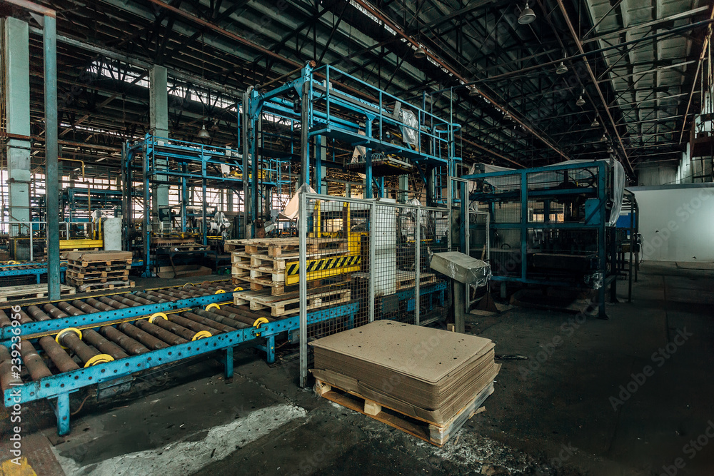 Old roller conveyor and packing machine in abandoned factory