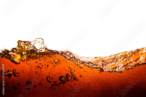 cola soda with sparkling bubbles isolated on white photo