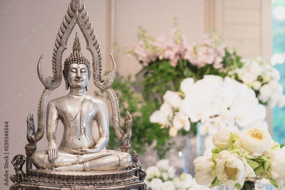 Thai wedding ceremony decoration with monk statue