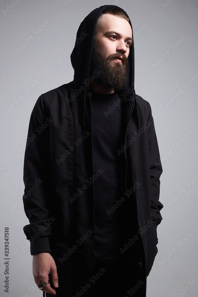 Fashion Man in Hood. Bearded Handsome Boy Fashion Man in Hood. Bearded Handsome Boy