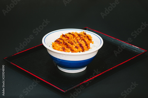 Tonkatsu or katsudon. Japanese deep-fried pork cutlet with egg and rice. isolated with black background