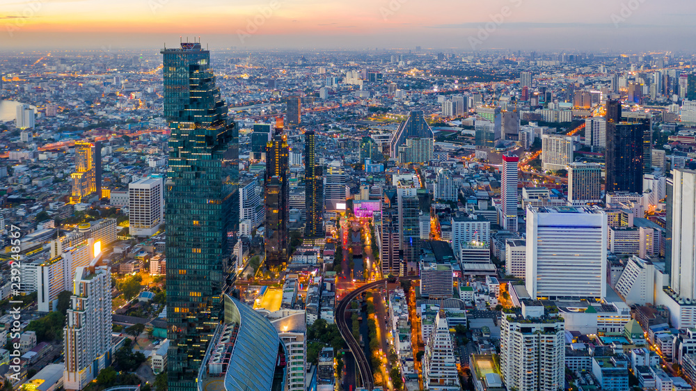 Bangkok skyline and skyscraper with bridge link between mrt and bts mass transportation on Sathorn Road center of business in Bangkok, Aerial top view, Bangkok, Thailand