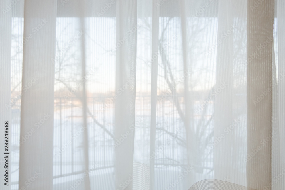 Fototapeta premium Defocused of curtain window and stationery box with sunlight in the winter season.