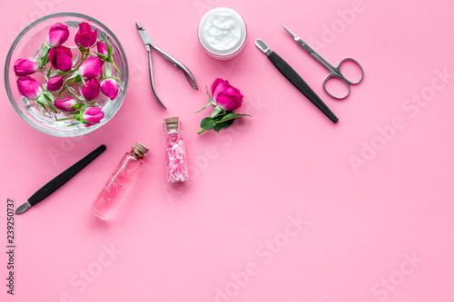 manicure tools set for nail care on rose background top view mock up