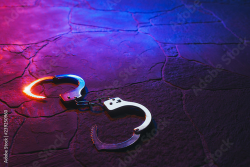 handcuffs on the floor at night