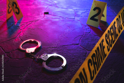 Fotografie crime scene handcuffs on the floor at night