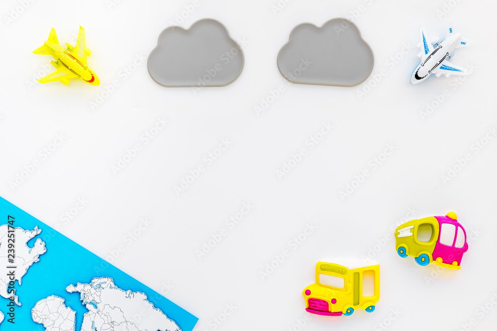 accessories for treveling with children, map and toys on white background top view mock-up accessories for treveling with children, map and toys on white background top view mock-up
