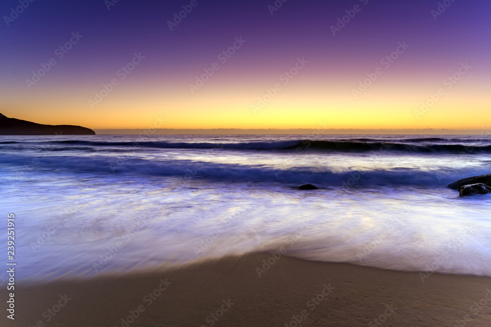 Beach, Headland and glowing Dawn Seascape