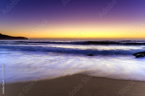 Beach, Headland and glowing Dawn Seascape
