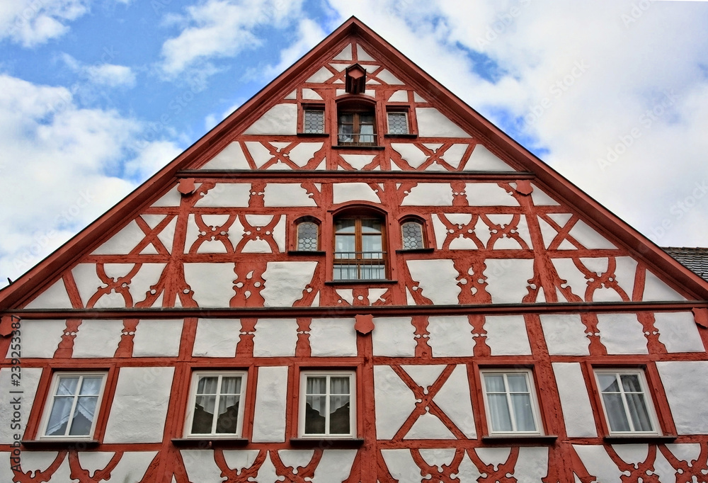 Traditional German architecture. Top of an ancient half-timbered house in a medieval old town. Germany. Bavaria. Rothenburg ob der Tauber.
