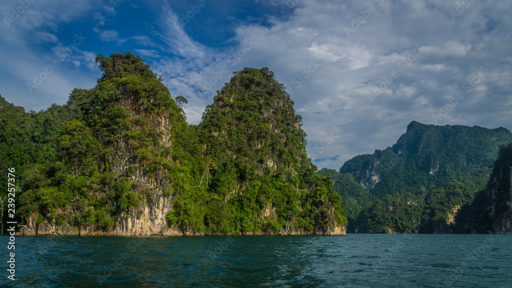 Panoramic view to landscape with mountains and Cheow lan lake natural attractions in Khao Sok National Park, Surat Thani Province, Thailand.