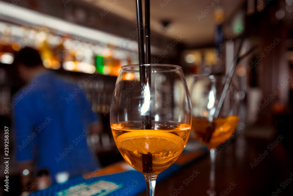 orange aperitif, a cocktail on the wooden table in the bar