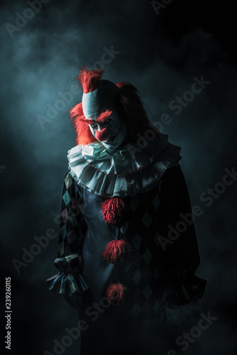Papier peint Scary clown on a dark background