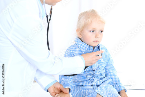 Doctor and a little blonde girl. Usual health exam. Medicine and healthcare concept © rogerphoto