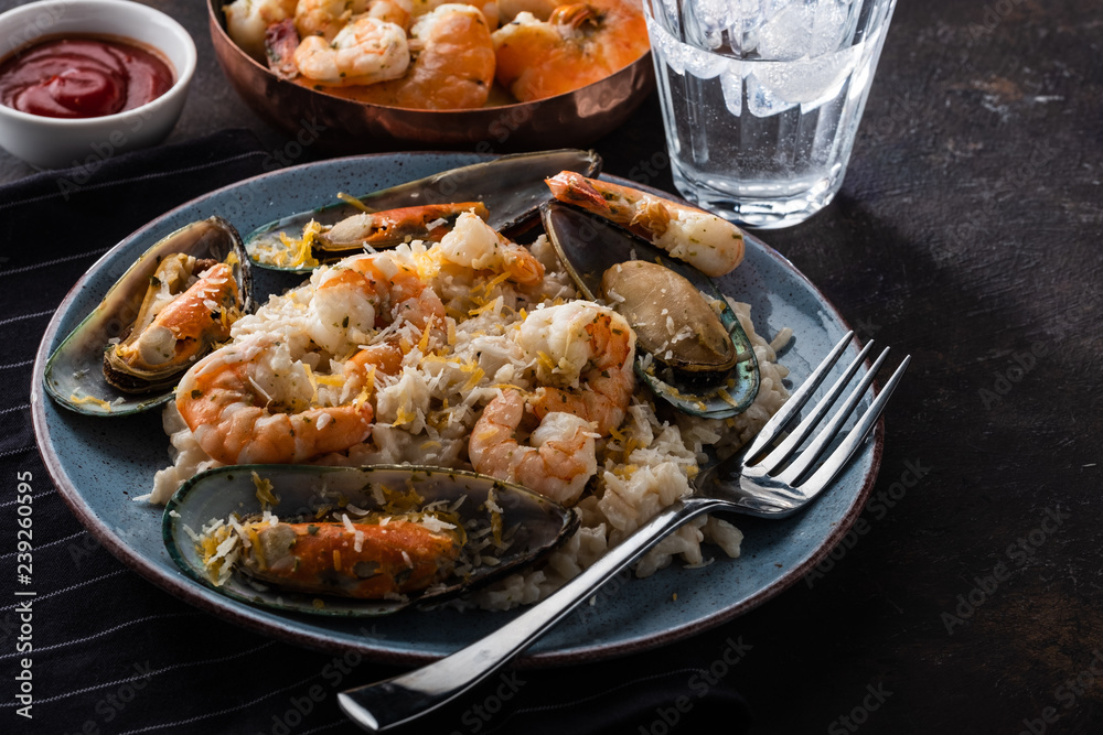Risotto with seafood. Rice with shrimps and mussels.