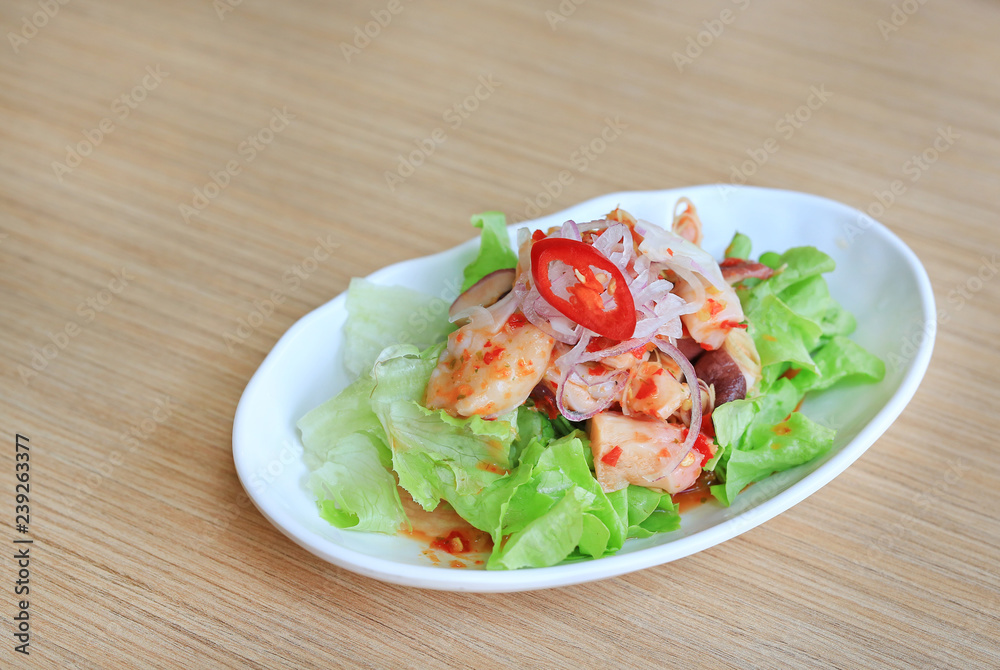 Japanese food, Spicy Octopus Tako salad on wooden table. Japanese food, Spicy Octopus Tako salad on wooden table.