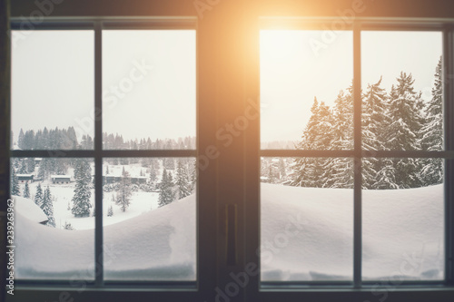 View of the winter landscape through the window. Vintage filter, selective focus