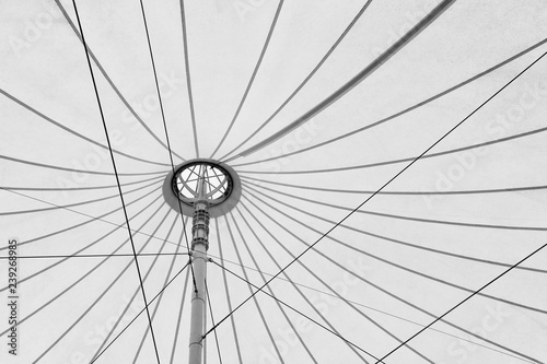 white fabric tensile roof, canvas roof and steel structure background in greyscale tone