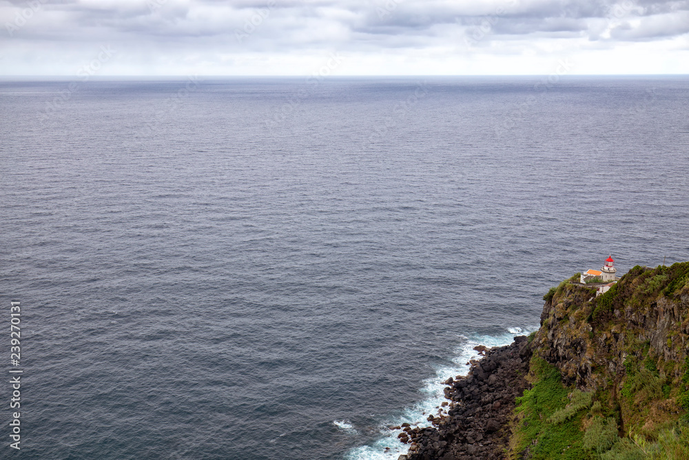 Beautiful Lighthouse in a misty summer day in the Azores Beautiful Lighthouse in a misty summer day in the Azores