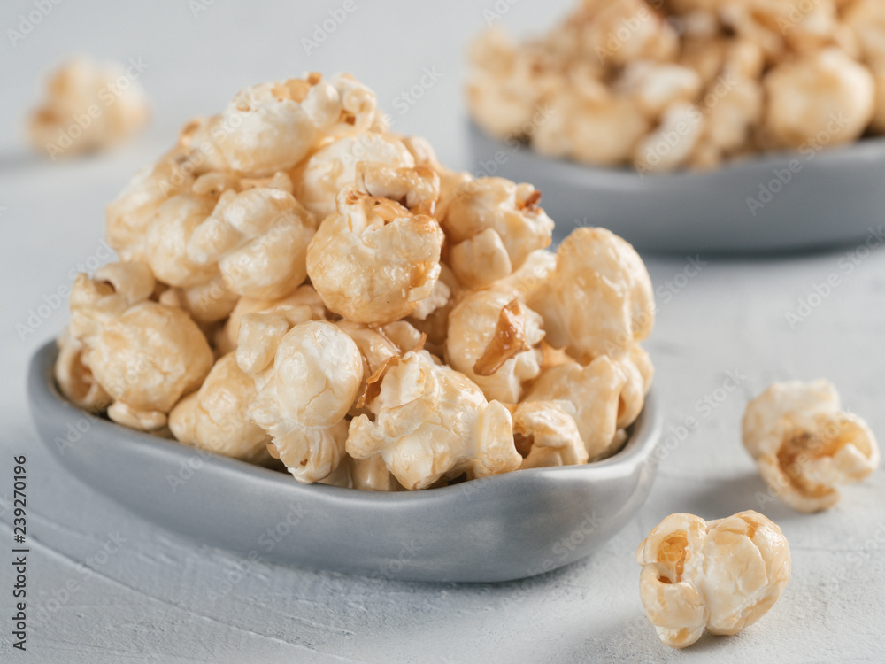 popcorn in gray craft trendy plate on gray concrete background. Moovie background with copy space. Top view or flat lay. popcorn in gray craft trendy plate on gray concrete background. Moovie background with copy space. Top view or flat lay.