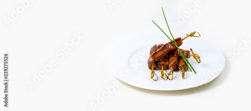 Beef Kebabs on a white plate on a white background isolated