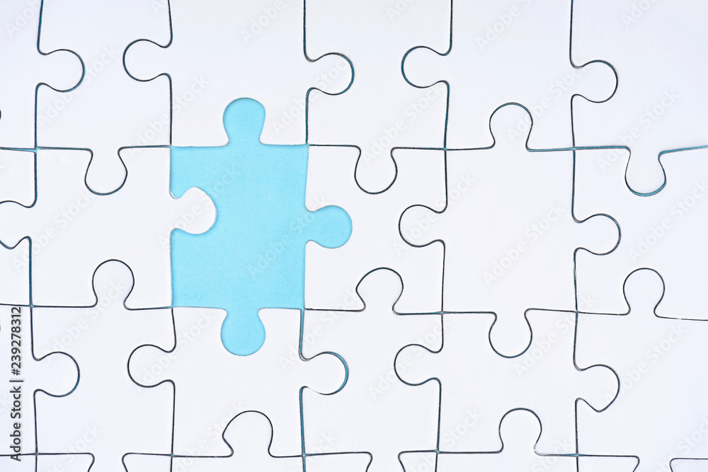 flat lay with white puzzle pieces on blue background flat lay with white puzzle pieces on blue background