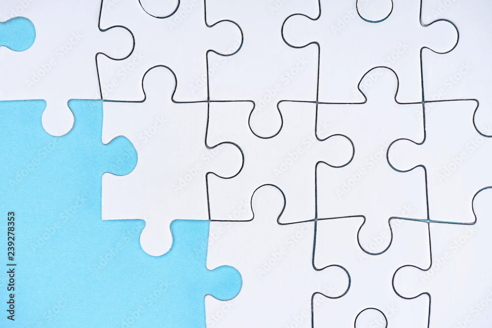 flat lay with white puzzle pieces on blue background flat lay with white puzzle pieces on blue background