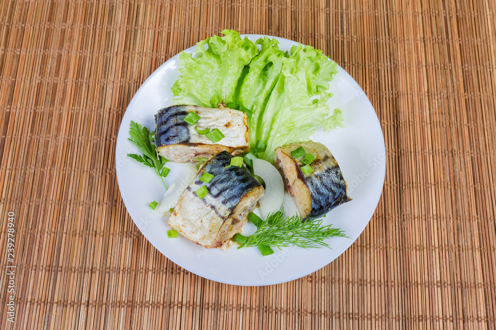 Top view of sliced baked Atlantic mackerel on dish Top view of sliced baked Atlantic mackerel on dish