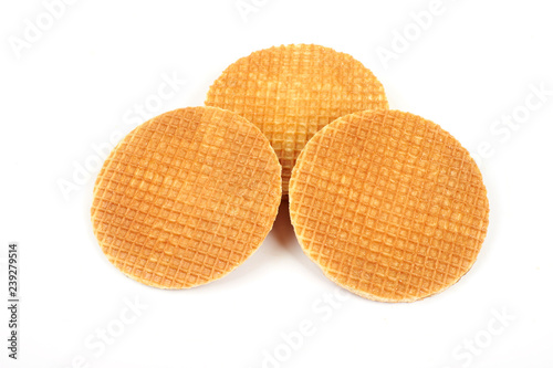 Round ruddy waffle isolated on white background.