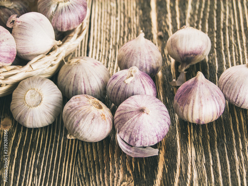 Solo garlic, single clove garlic on wooden background copy space