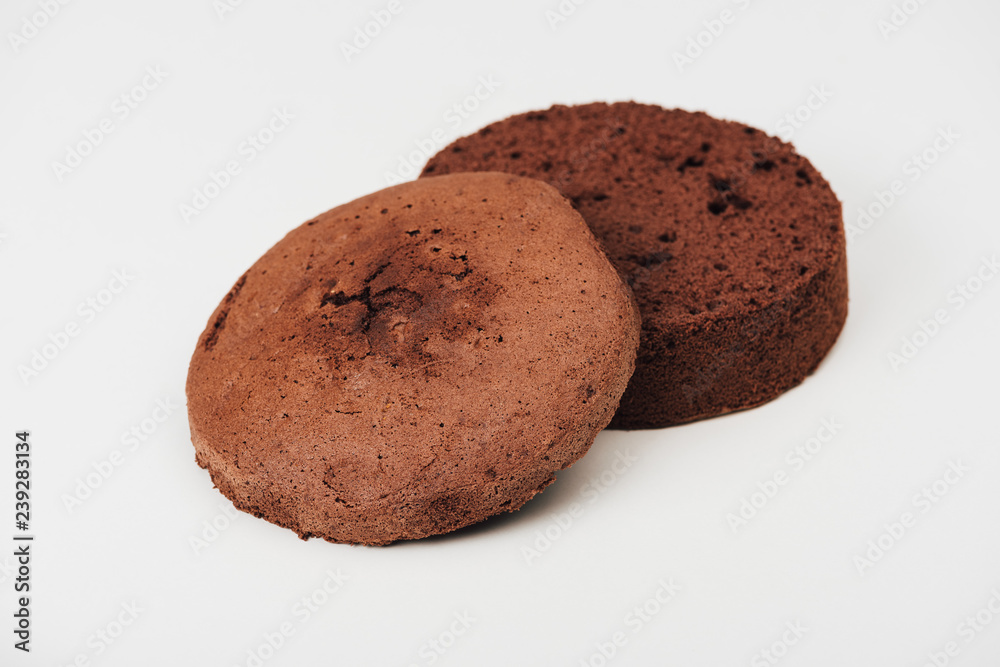 close-up view of delicious sliced chocolate cake isolated on white close-up view of delicious sliced chocolate cake isolated on white