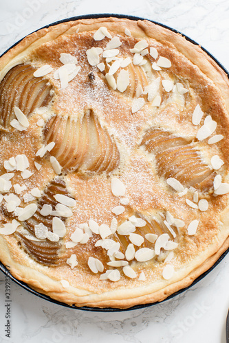 Tart with poached pears and almond frangipane photo