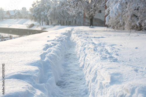 Winter scenery - narrow pathway through the deep snow © eshana_blue